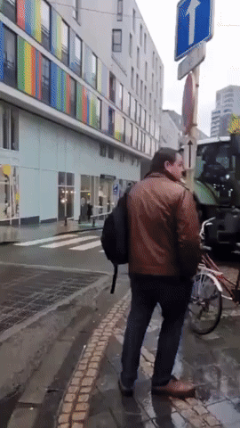 Water Cannons Force Tractor to Reverse During Brussels Farmers' Protest