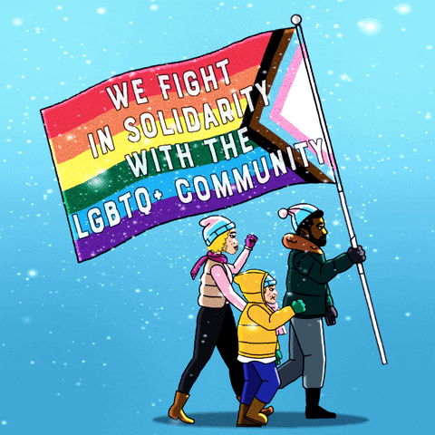 Illustrated gif. A diverse trio of a man, woman, and child, march in the snow, fists of solidarity in the air, the man holding a Quasar Pride flag that reads, "We fight in solidarity with the LGBTQ+ community."