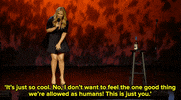 Celebrity gif. Performing standup, Amy Schumer pats her thighs with her palm and then gestures at the audience with her hand while she says "It's just so cool. No, I don't want to feel the one good thing we're allowed as humans! This is just you," which appears as text.