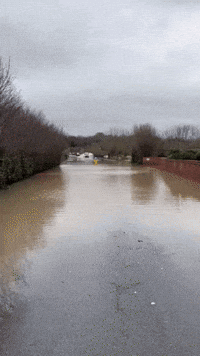 Cars Drive Through Storm Henk Floodwaters in Worcestershire