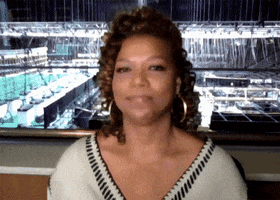 Celebrity gif. Queen Latifah on the Tonight Show kind of smiles, looking proudly at us, as she shakes her head and applauds. 