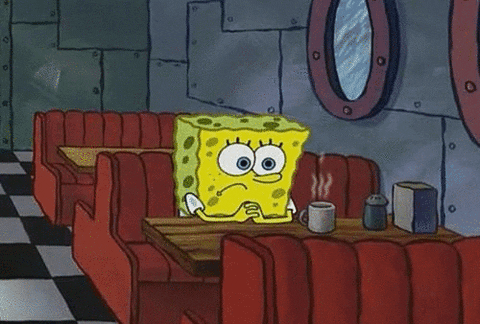 Spongebob gif. SpongeBob sits in a restaurant in a booth. He looks down sadly at a steaming cup of coffee. He has his hands clasped together on the table.