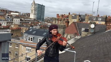 Musician Plays 'You'll Never Walk Alone' on London Rooftop Amid New Isolation Guidelines