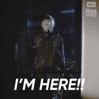 Sponsored gif. Michael Myers from Halloween calmly walks through a glass door and shatters it. In the upper right corner is the AMC Fear Fest logo. Text reads, “I’m here!”