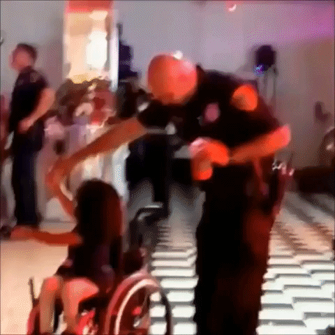 Cop and Wheelchair User Show Off Dance Moves at Houston Party