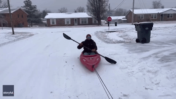 Kentucky Man Kayaks Through Snowy Streets While Towed by Car