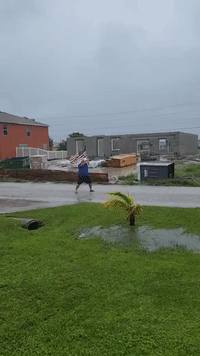 Florida Man Poses With US Flag as Hurricane Winds Hit Cape Coral