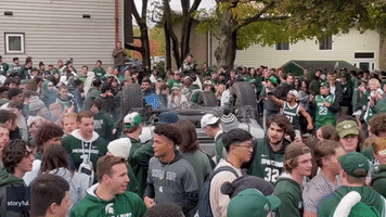 Explosion Scatters People at Street Party for MSU