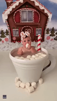 Adorable Baby Sits in Cup of 'Hot Chocolate' Eating Marshmallows