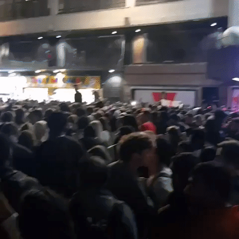 Fans Celebrate England Win in London's Leicester Square