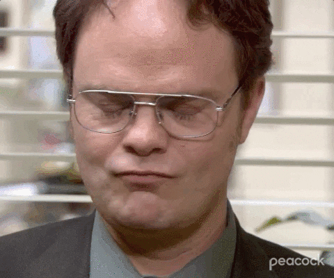 The Office gif. Rainn Wilson as Dwight Schrute speechless, closing his eyes, shaking his head, looking up, and taking a deep breath.