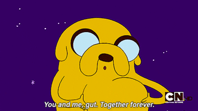 Cartoon gif. Jake from Adventure time caressess his stomach and hugs it while saying, "You and me gut. Together forever."