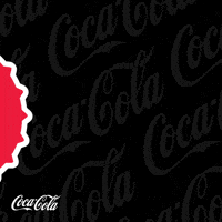 Sponsored gif. An illustration of a red Coca-Cola bottle cap rolls in from the left, pauses, and then rolls off to the right. Text on the cap reads "Vida." Gray Coca-Cola logos float by in the background, and a white Coca-Cola logo is in the lower left corner. 