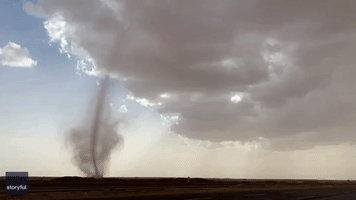 Possible Tornado Towers Over Saudi Desert