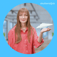 Sponsored gif. Woman holds one hand palm side up while a paper airplane floats over it. She blows air at the airplane and it suddenly takes off through the air. Text reads, “Send it.”