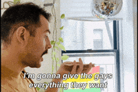 Celebrity gif. Rod Thomas holds his phone in his palm and says into the microphone, resolutely, "I'm gonna give the gays everything they want," which appears as text.