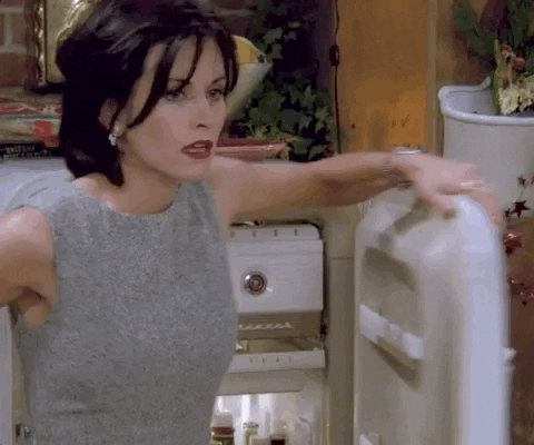Friends gif. Courteney Cox as Monica is relieved as she backs up against an open refrigerator to cool off.