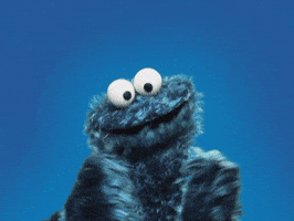 Sesame Street gif. Cookie Monster claps his hands excitedly.
