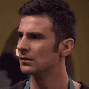 Video gif. Man perplexedly raises and furrows his eyebrows.