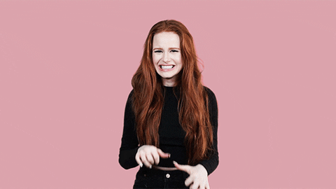Celebrity gif. Madelaine Petsch pulls her hands back towards her as she cringes and backs away from us. 