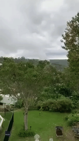 Funnel-Shaped Cloud Fascinates Sydney Neighbors Before Downpour
