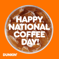 Sponsored gif. Mug of Dunkin’ Donuts iced coffee spins in place. Text reads, “Happy National Coffee Day!”