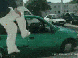 Video gif. A man jumps directly through the passenger window of a small car, feet first, with otherworldly agility, and lands in the seat with decisive ease. Text, in.