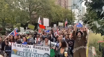 Anti-Vaccine-Mandate Protesters Tear Down COVID-19 Testing Tent as They March Into Manhattan