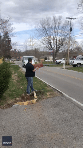Woman Can't Stop Laughing as Brother Holds Mailbox for Delivery