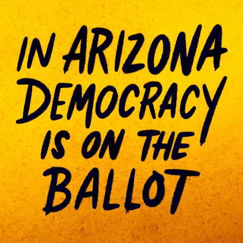 Text gif. Handwritten capitalized text against yellow and orange background reads, “In Arizona democracy is on the ballot.” A hand holding a can of blue spray paint underlines the word, “Arizona.”