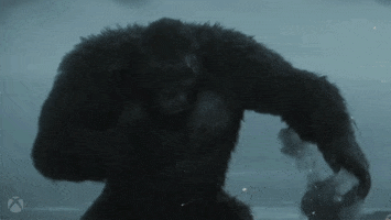 Video game gif. King Kong in a cutscene from Call of Duty: Warzone, pounds his chest and then growls, baring sharp teeth.