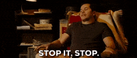 Movie gif. John Leguizamo as Mauricio in Nothing Like the Holidays sits in an armchair and waves his hand dismissively, shaking his head and saying, "stop it, stop," which appears as text.