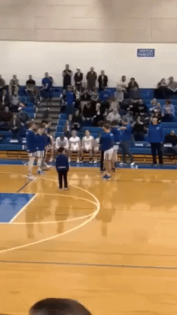 8-Year-Old Impresses With Pregame Handshakes at High School Basketball Game in Michigan