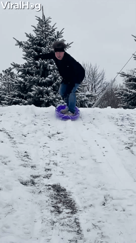 Manβs Sledding Stunt Ends in a Snowy Roll