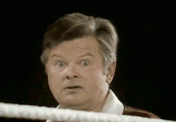 Celebrity gif. Benny Hill looks around wildly confused then looks directly at us. Yellow text reads, “WTF???!!!”