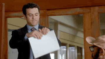 TV gif. Fred Savage as Stewart from The Grinder. He tears a piece of paper in half while gritting his teeth and pursing his mouth.