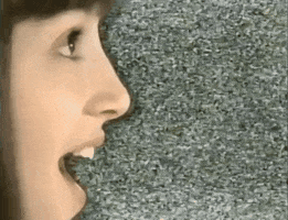Video gif. Against a vintage TV static screen, we see the side of a woman's face. Her mouth hangs open while text reading, "Cooool!" emerges from her mouth in a yellow textbox.