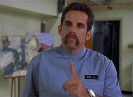 Movie gif. Ben Stiller as Hal L in Happy Gilmore. He's a tough looking nurse and he puts a finger to his lips before draws a thumb across his throat in a threatening manner