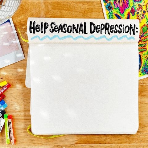 Digital art gif. Notebook on a desk with colorful art, pastels, and a disco ball. Text, "Help seasonal depression, Keep your routines, make your space bright, get outside, exercise, socialize."