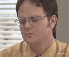 The Office gif. We zoom in on an angry Rainn Wilson as Dwight who blinks and coldly stares offscreen.