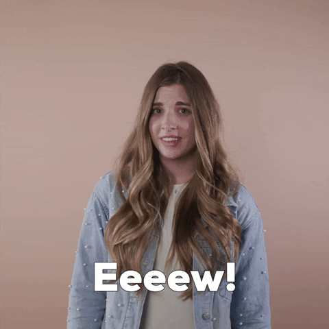 Reaction gif. A light-skinned woman with big eyes, shiny bronde hair, and cerebral palsy closes her eyes and shakes her head, saying, "Eeeew!"