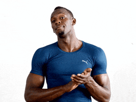 Sports gif. Usain Bolt is wearing an athletic shirt and claps slowly as he furrows his brow and nods, impressed.