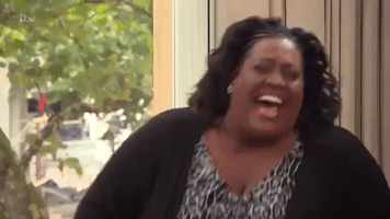 Celebrity gif. Alison Hammond throws her head back in hysterical laughter, hand to her nose, stifling a snort.  
