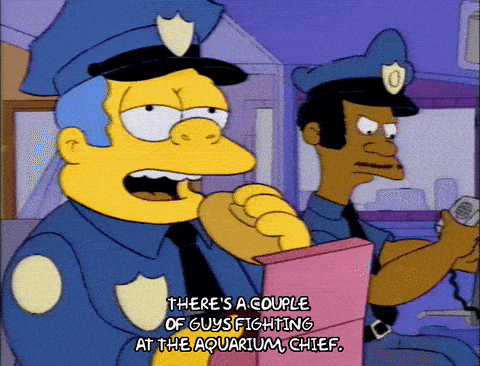 A taxi driver is going down a one way street the wrong way, and goes past 5 police officers.