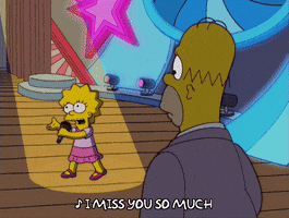 The Simpsons gif. Homer watches Lisa singing sadly on stage. She sings, “I miss you so much.”