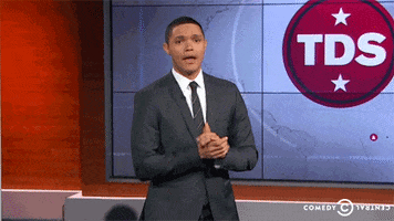 The Daily Show. Trevor Noah claps his hands and makes a wowed expression as he looks at us.