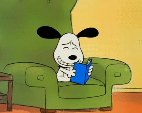 Peanuts gif. Snoopy sits in an armchair, reading a book that makes him laugh hysterically and slap his knee.