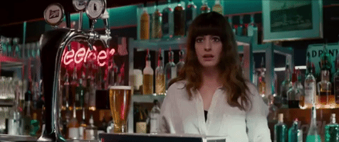 scared anne hathaway GIF