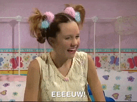 TV gif. Amanda Bynes on the Amanda Show dressed like a little girl with springy pigtail braids pinned to the top of her head, scowling in disgust and turning away while covering her face with her arms. Text, "Eeeeeeuw!"