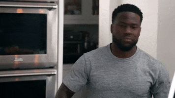 Reality TV gif. Kevin Hart on Real Husbands of Hollywood shakes his head vigorously as he frowns. 